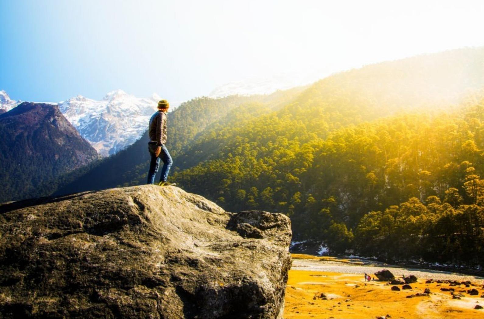 A tourist is walking at the Yumthang Valley in North Sikkim, India.