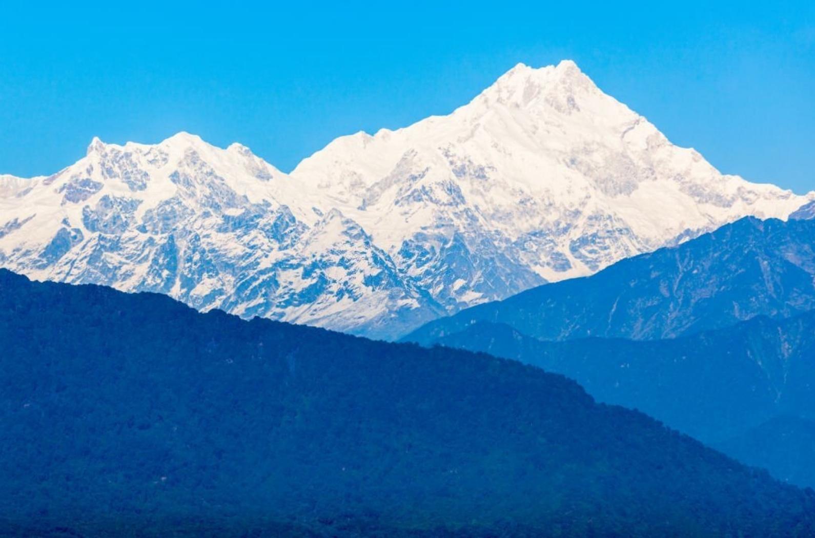 Kangchenjunga is the third highest mountain in the world, and lies partly in Nepal and partly in Sikkim.