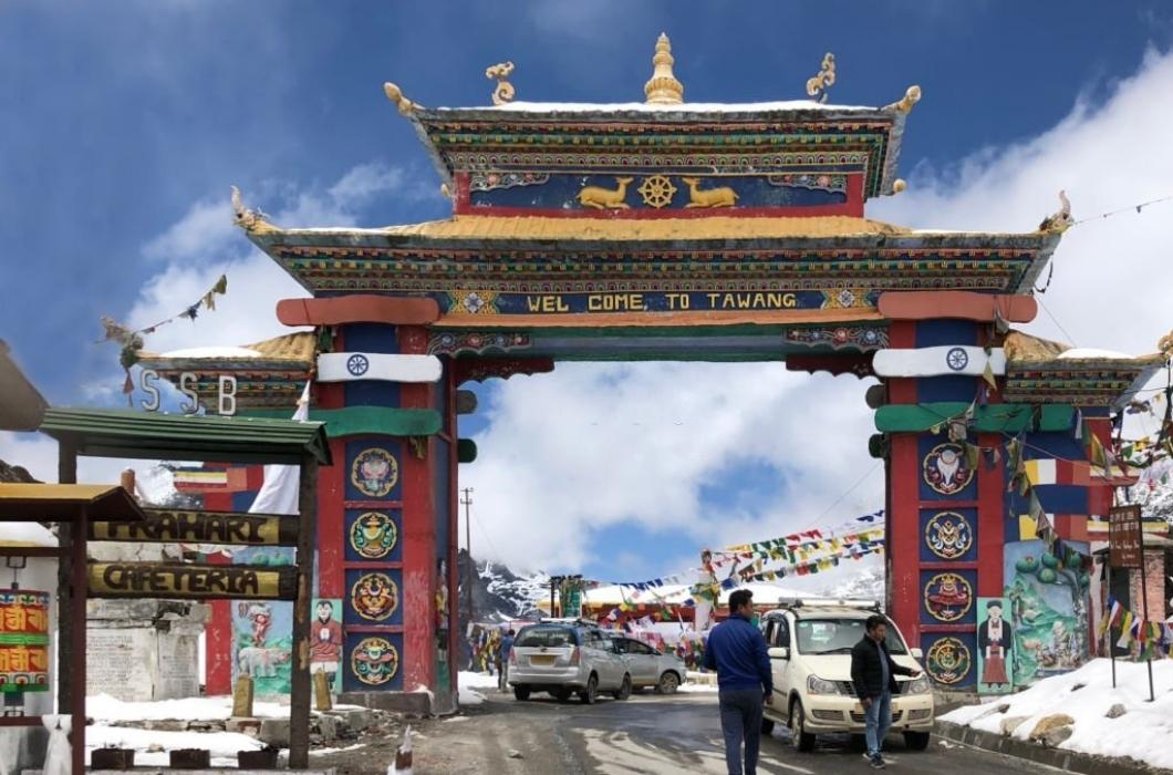 Sela Pass Gate with tourist cabs and drivers.