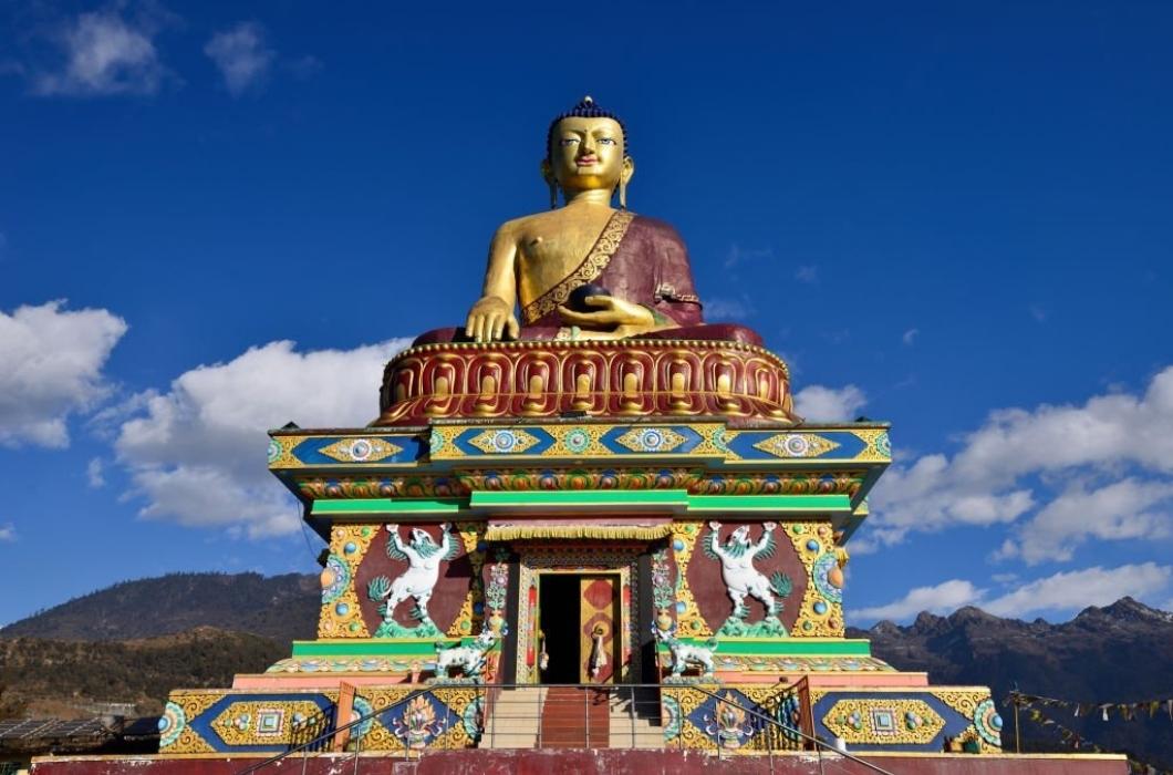 The colour prayer buddha statue on the hillside which surrounding Tawang.
