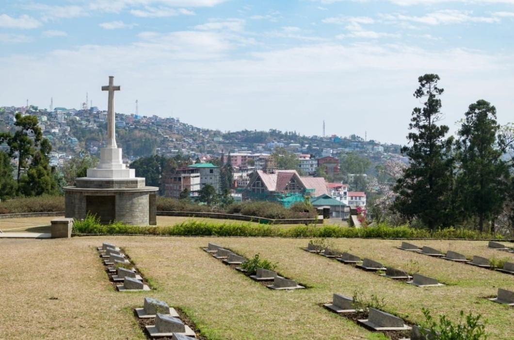 A white cross at the Kohima war cemetery in Nagaland, India where a famous battle was fought in World War II