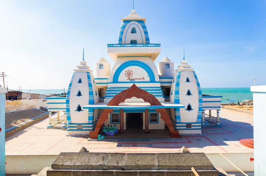 Entrance to white Gandhi Memorial Mandapam on the ocean waterfront at the southernmost tip of subcontinent on a sunny day।