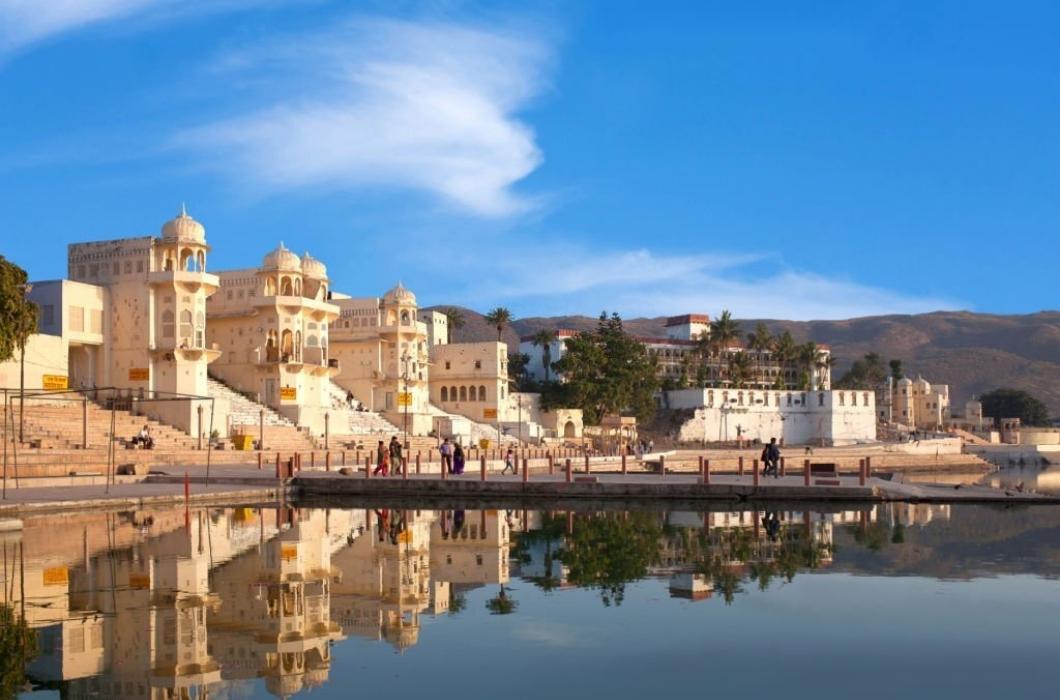 Pilgrims walking on Chandra Ghat along Pushkar Sarovar lake. It is located in Ajmer district of the Rajasthan state. Pushkar Lake is a sacred lake of the Hindus and Sikhs.