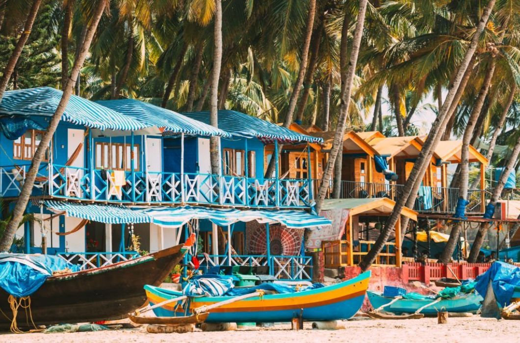 Fishing Boat And Famous Painted Guest Houses On Palolem Beach.