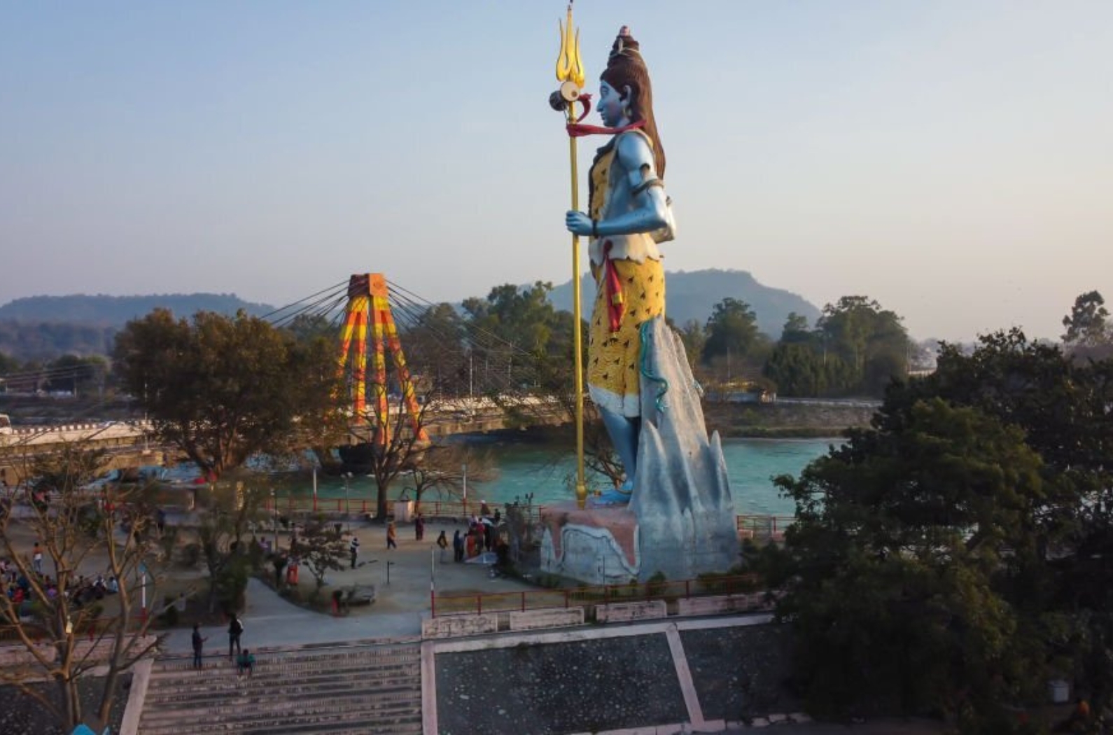 Hindu god shiva statue with bright blue sky background at morning from different angle image is taken at Haridwar, Uttrakhand.