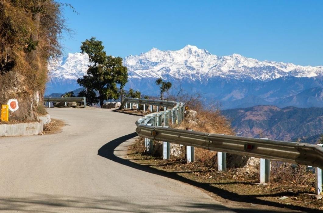 Mussoorie road and Indian Himalaya. With white mountains.