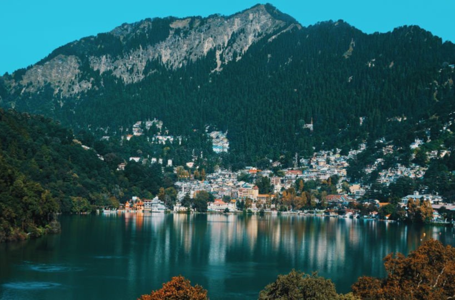 Nainital Lake, a natural freshwater body, situated amidst the township of Nainital in Uttarakhand State of India, tectonic in origin, is kidney shaped or crescent shaped and has an outfall at the southeastern end. Nainital is most popular.