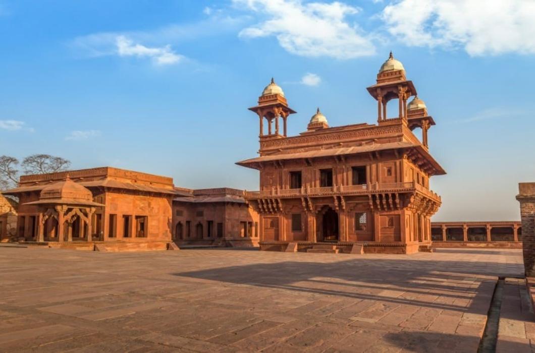 Fatehpur Sikri is a beautifully crafted red sandstone fort city and a classic example of Mughal architecture in India.