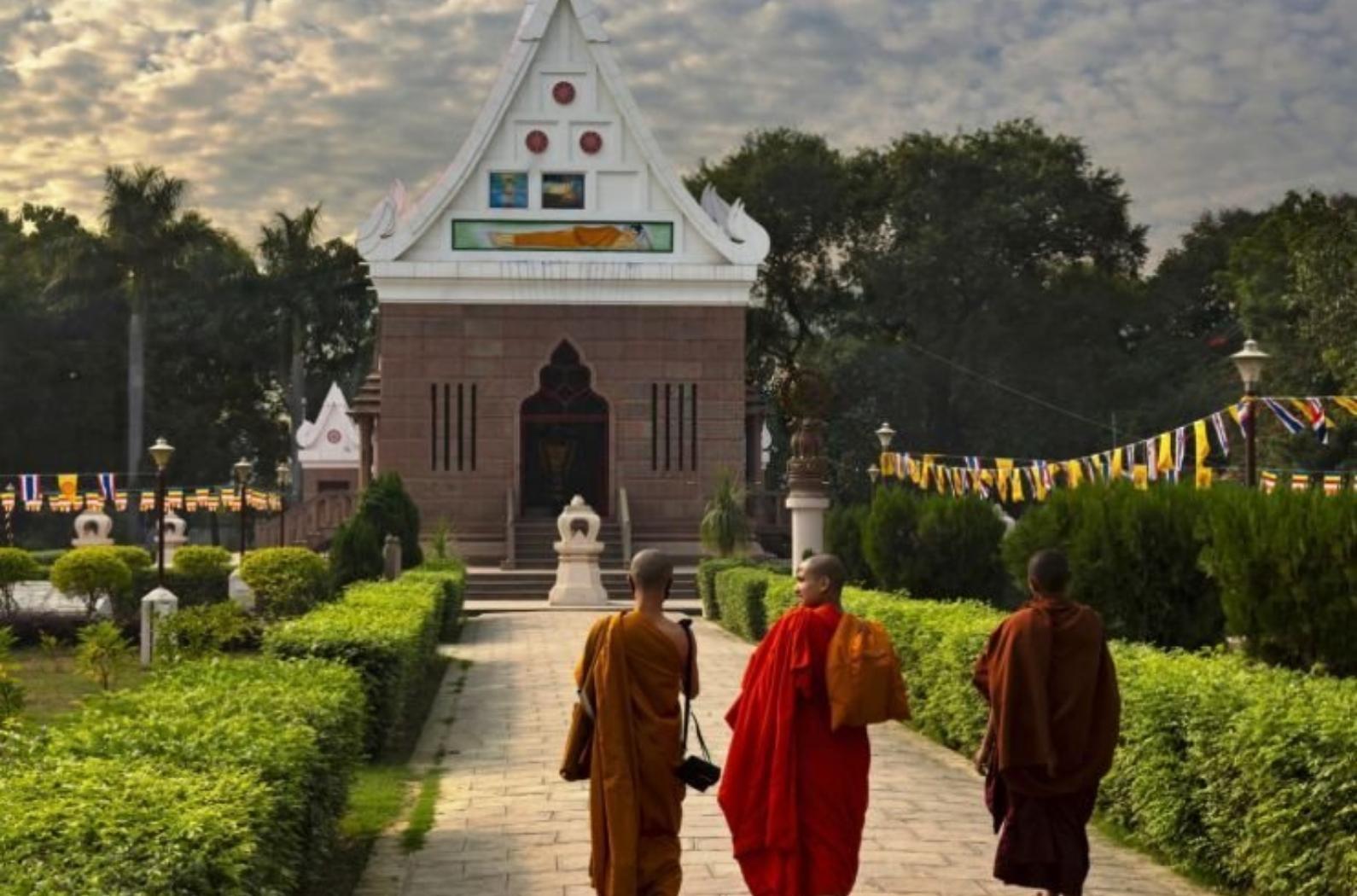 Three buddhist monks _go to work_ to the Wat Thai Sarnath Temple.