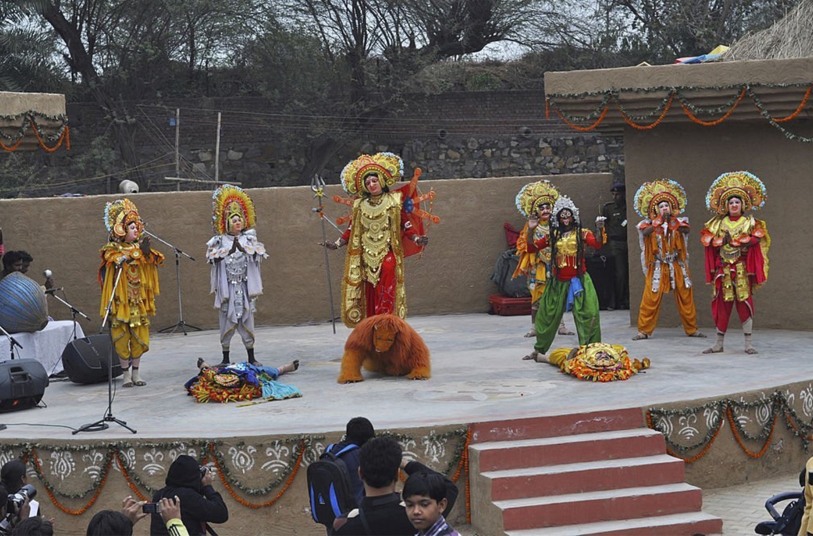 India's Famous Chhau Dance in group of people at Suraj Kund Fair Faridabad India.