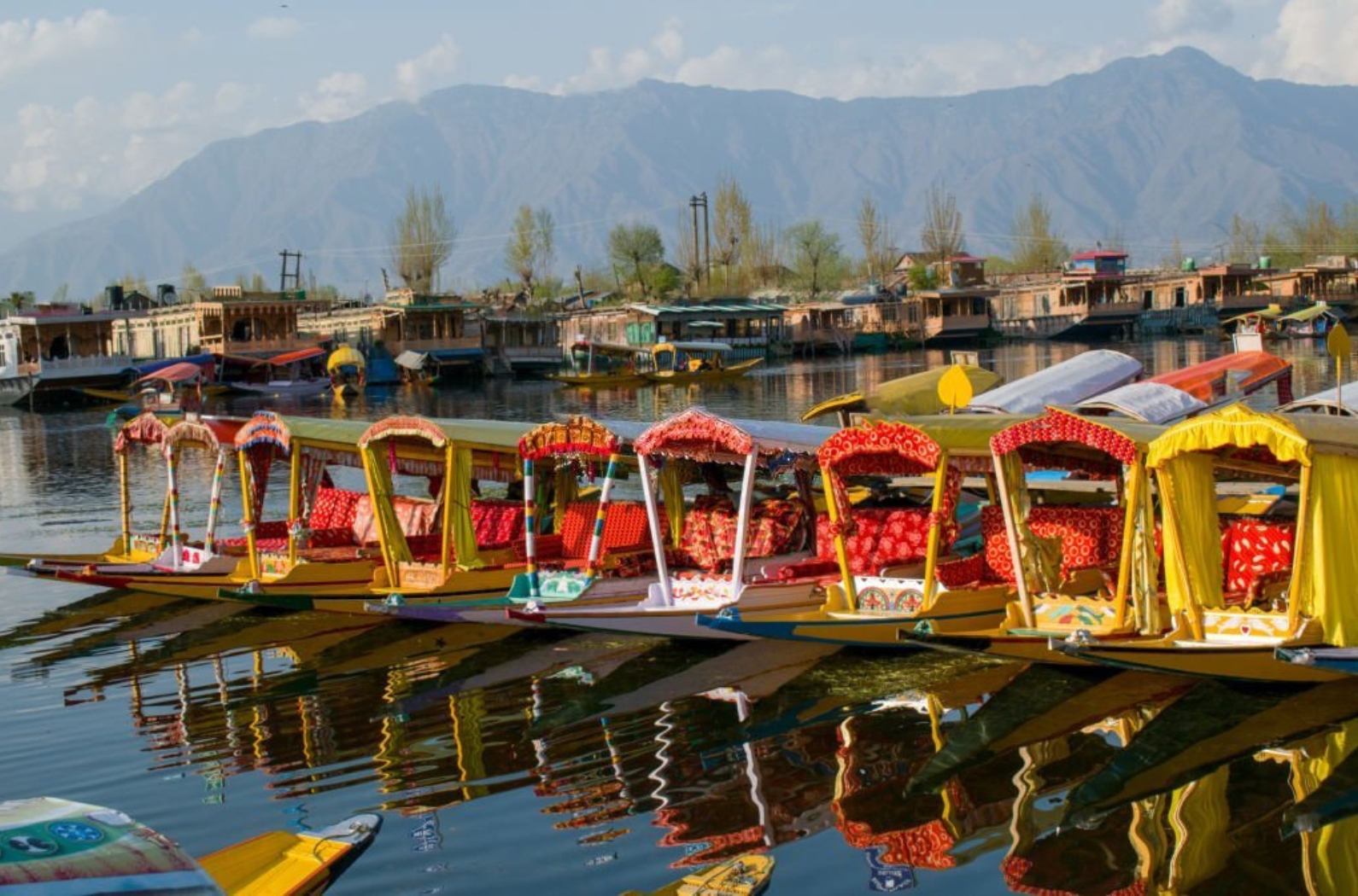 Nicely decorated Sikara - Boat at Dal lake Srinagar - Kashmir in which tourist are enjoying the rides.