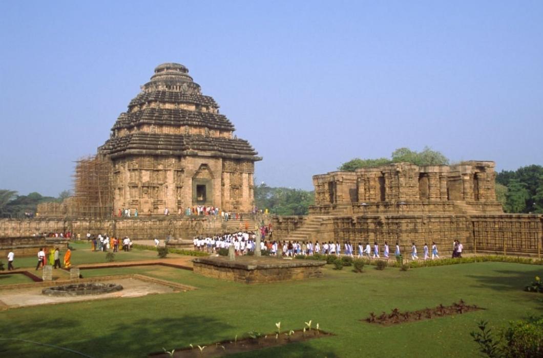 Konark - Local tourists at the ancient Surya Hindu Temple. 13th Century AD. A masterpiece of Odishan temple architecture and a World heritage site