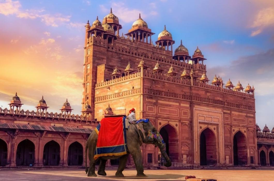 Decorated elephant used for tourist ride near Buland Darwaza Fatehpur Sikri Agra. A beautifully crafted giant red sandstone gateway to Fatehpur Sikri