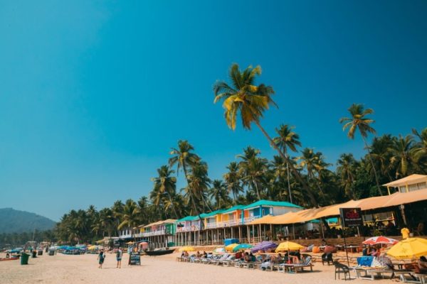 People Resting At Famous Palolem Beach In Summer Sunny Day. Canacona, Goa, INDIA.